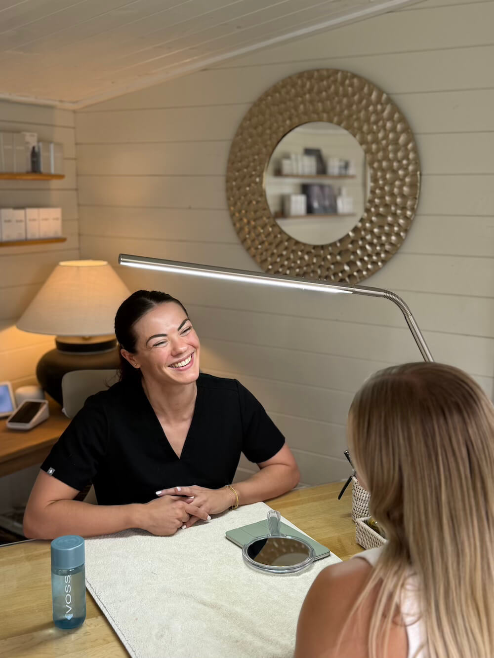 The Adorabella practitioner speaking with a client in the Lutterworth studio