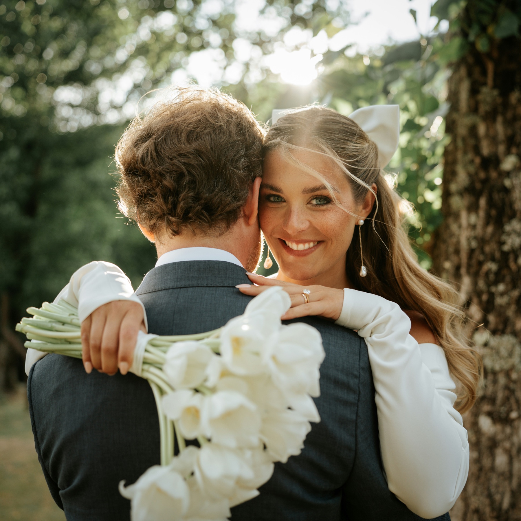 Bride smiling during an outdoor wedding portrait